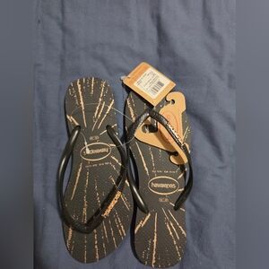 Havaianas Black Flip Flops with Gold Burst Print